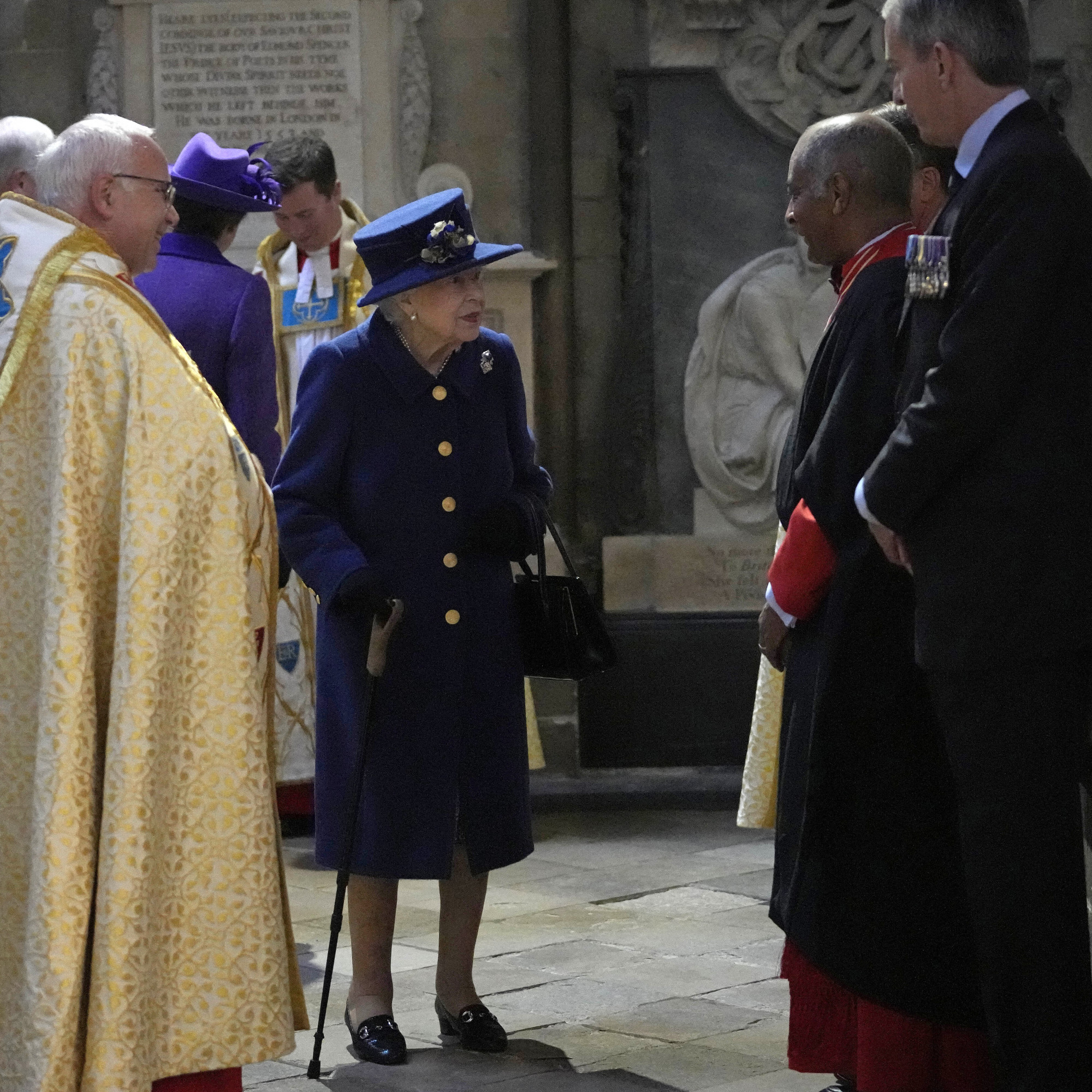 Queen Elizabeth II was photographed with a wand, and the United Kingdom moved